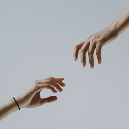 Two hands reaching out for support