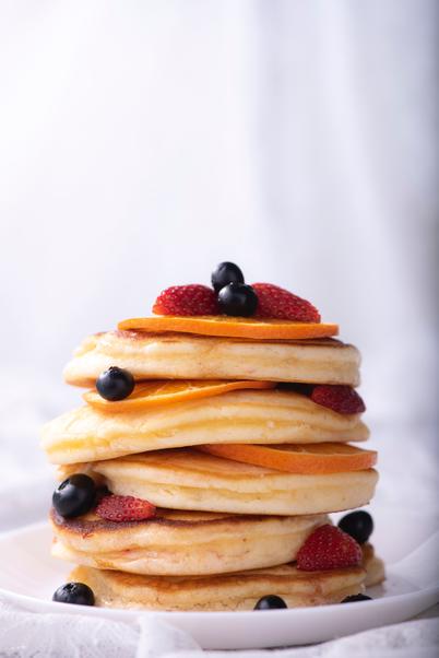 pancake stack with blueberries and strawberries